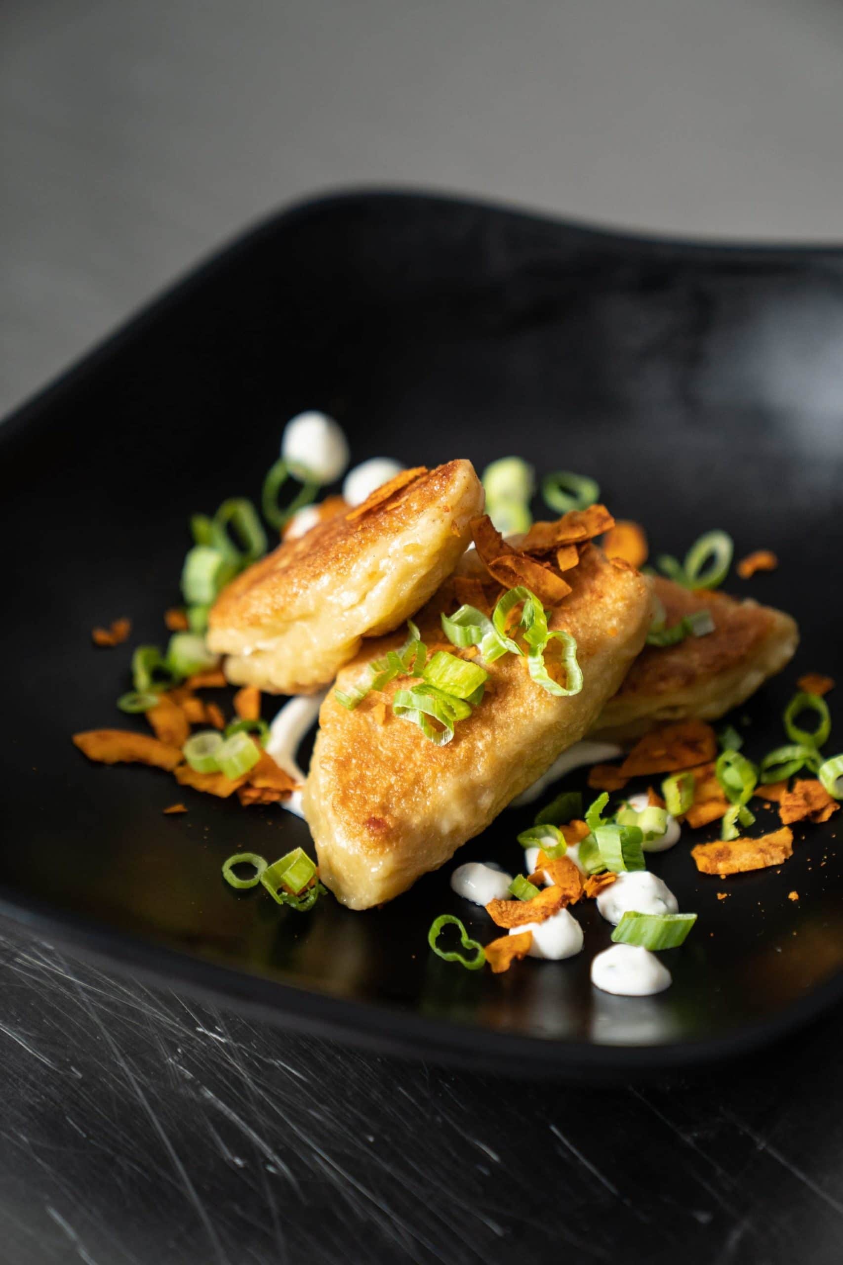 Potato & Cheese Pierogi | Shaved Coconut Amino | Chive Tofu | Potato