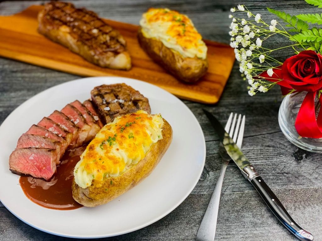 Loaded Twice Baked Potato with Grilled New York Strip Steak Consumer